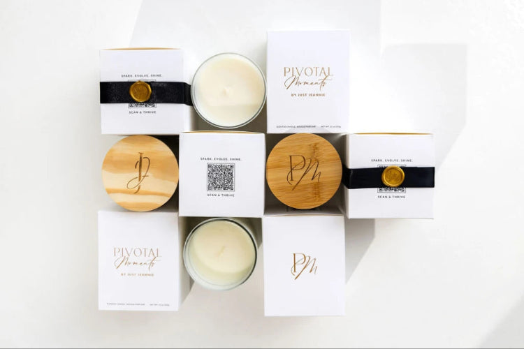Candle packaging with wooden lids and branded boxes on a white background