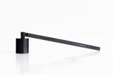 Black candle snuffer on a white background