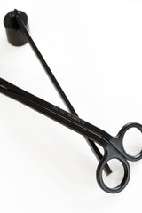 Black matte candle snuffer and wick trimmer with 'Private Moments' branding on a white background