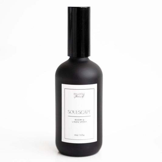 A black bottle of 'Soulscape' room and linen spray with a white label.
