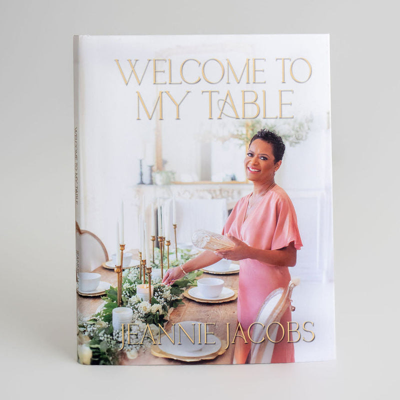 Book titled 'Welcome to My Table' by Jeannie Jacobs on a white background
