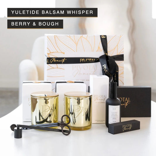 Festive Holiday Gift Set in Yuletide Balsam Whisper and Berry & Bough by Pivotal Moments: two gold PM candles, room spray, candle care kit, and matches in a luxury gift box